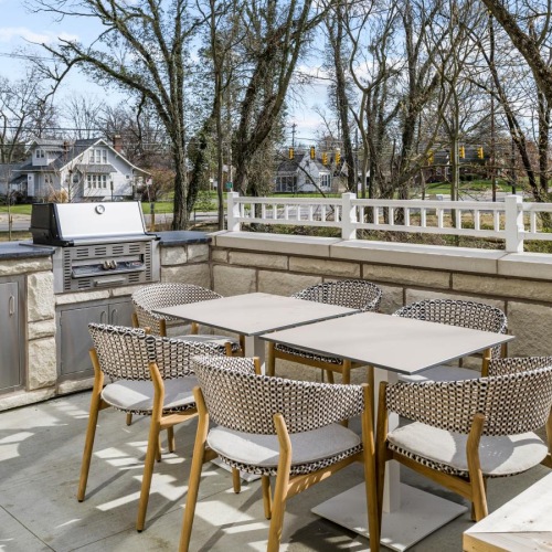 Take advantage of all Brookwood Point has to offer a deck with tables and chairs